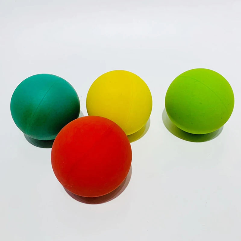 Four colorful squash balls for training and competition - green, yellow, red, and blue - 5.5cm.